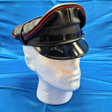 Muir cap with red piping around upper edge