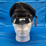 Muir cap with black piping around upper edge